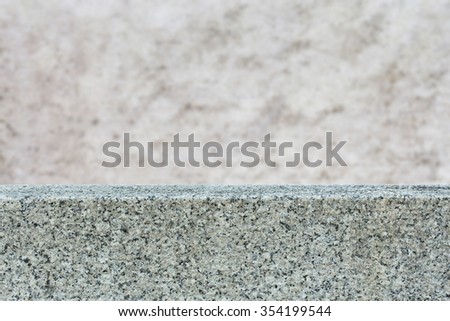 Marble table top and grunge concrete cement wall with weathered dirty for display or montage your products