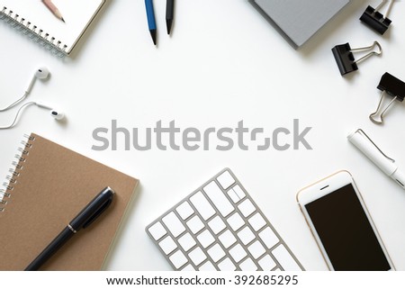 Mix of office supplies and business gadgets on a modern office desk