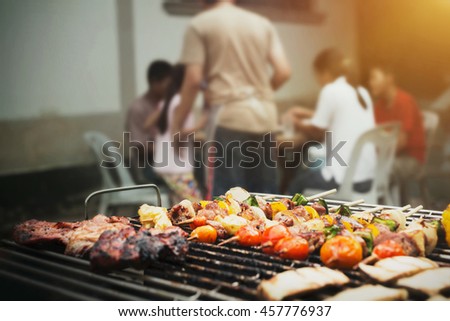 Close up barbecue grills at barbecue party at countryside in holiday time of family and child.