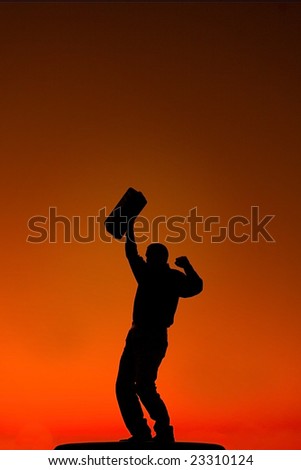 Business man raising fist in air