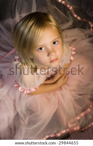 Young child in ballet dress from above