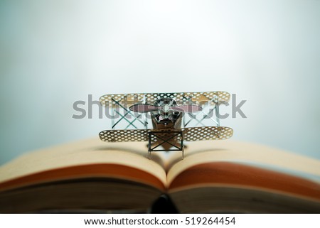 aircraft fighter on open education book with abstract light , education planner\
concept.