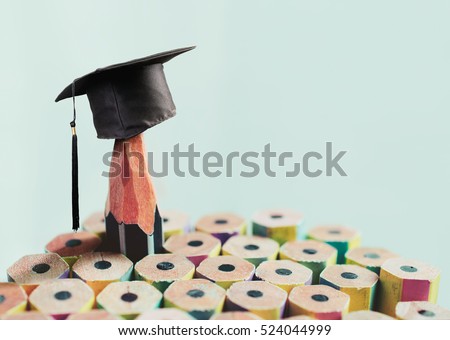 congratulations graduates background, inscription in pencil and graduate cap