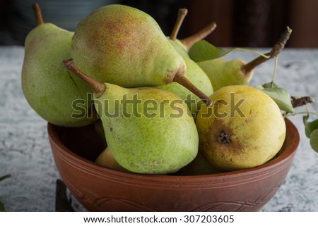 Pears on a rustic table, close up.