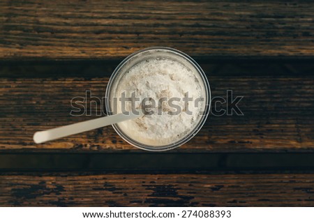 Coffee milkshake on a wooden bench, top view