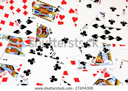 Deck of cards scatter all over on a table