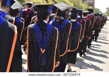 Graduates of the university ,Walking in line to get a diploma.