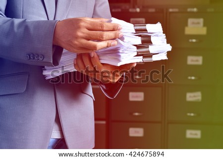 document management,Businessman examining documents