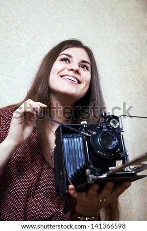 Young girl with big old camera rarity