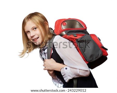 Girl student of the school drags a heavy bag isolated