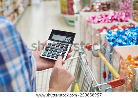 Housewife considers costs in the store