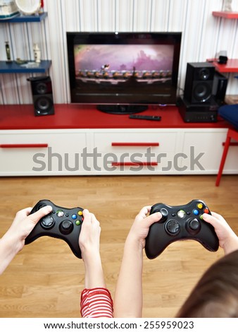 Children playing on a games console