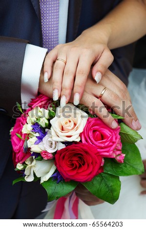 stock photo Hands of bride and groom with wedding gold ring and wedding