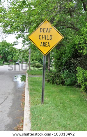 Deaf Child Area Traffic Sign on Grass Curb Suburban Residential Neighborhood