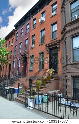 Colorful Brownstone Home Trash Cans in Gated Area Urban Residential Neighborhood Brooklyn New York