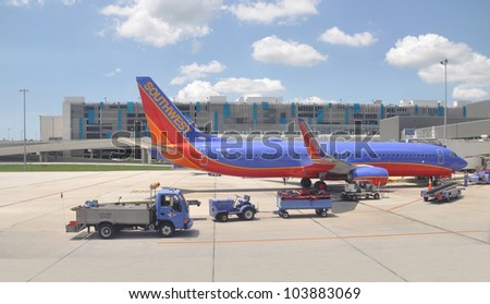 FORT LAUDERDALE, FLORIDA - MAY 27: USA most successful low budget airline Southwest began in 1971 has more than 3,200 domestic flights is preparing plane for takeoff from Ft. Lauderdale May 27, 2012.