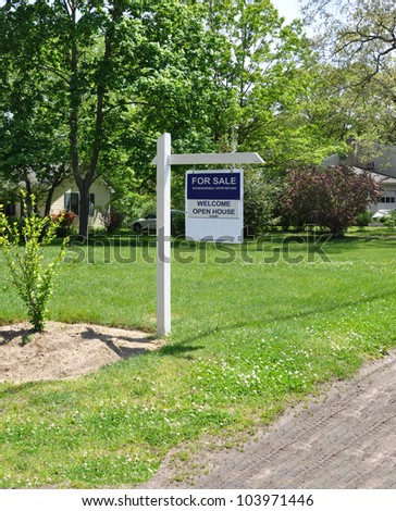 Real Estate For Sale Welcome Open House Sign on Front Yard lawn of Suburban Residential Neighborhood Home