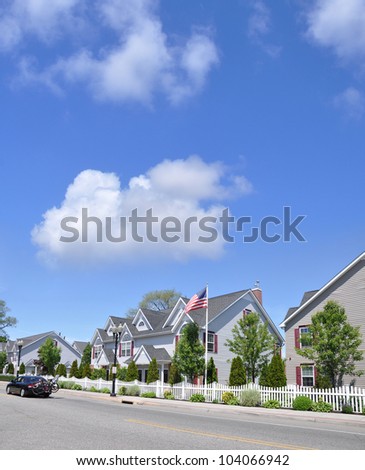 Suburban Neighborhood Street Car Bicycles American Flag Town Homes Sunny Blue Cloud Sky Day