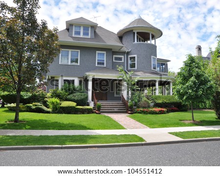 Three Story Victorian Style Home Landscaped Front Yard Lawn Sidewalk Curb Street Residential Suburban Neighborhood