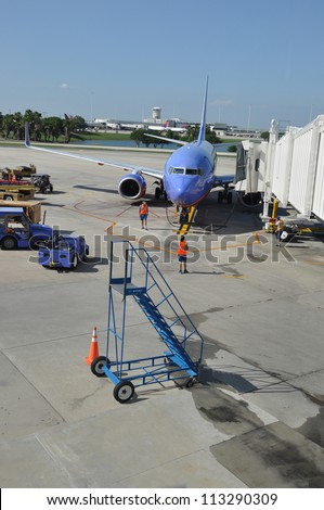 ORLANDO, FLORIDA - MAY 27: Southwest Airline (in existence for 42 years serves 103 destinations and employs more than 46,000 people) employees preparing plane at Orlando Airport Florida May 27, 2012.