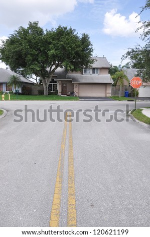 Suburban Street Stop Sign Home Snout Back Split Architecture Residential Neighborhood Blue Sky Clouds