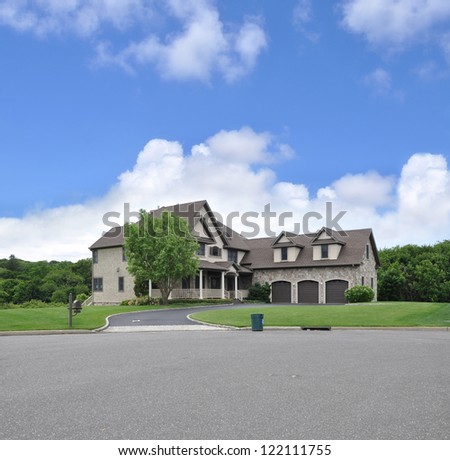 Large Suburban McMansion Home Trash Can Curbside Clouds Blue Sky Day Time
