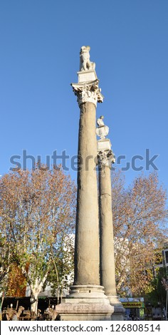 SEVILLE, SPAIN - JAN 5: Roman columns with statues of Hercules and Julius Caesar built in 1574 (The Alameda de Hercules, or La Alameda  stands in a garden square in Seville.  Jan 5, 2013.