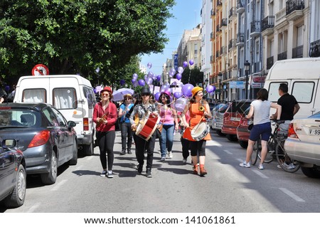 VALENCIA, SPAIN - MAY 25: Band leading 2nd Female Clown Solidarity (II Trobada Solidaria De Dones Pallasses) marching for women\'s rights through the streets of Valencia, May 25, 2013.