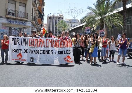 ALICANTE, SPAIN - JUN 15: Demonstration protest march against bullfighting in Spain on Calderone de la Barca St. Sign says\