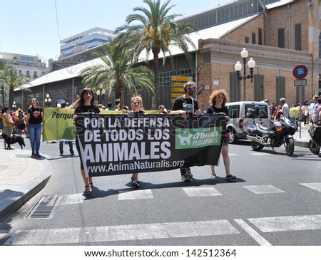 ALICANTE, SPAIN - JUN 15:Animal rights group with banner\