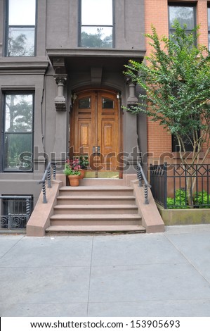 Brownstone Home Entrance with potted flowers