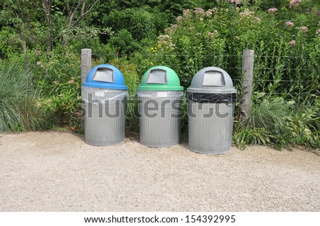 Trash Containers for Paper Cans and Garbage on footpath in Brooklyn Bridge Park in New York USA