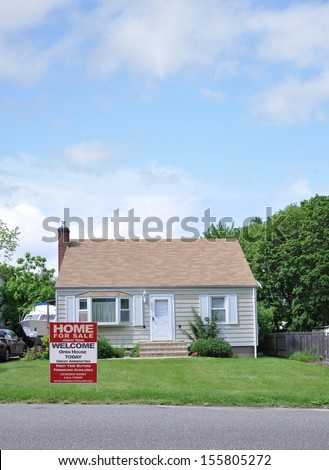 Real Estate House for Sale Great Deal Open House First Time Buyers Welcome sign on front yard lawn of bungalow cottage style home in USA Blue Sky clouds