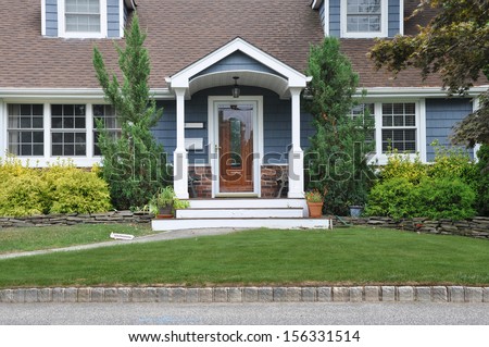 Suburban Home Cape Cod Style Architecture Entrance front Yard USA Residential Neighborhood