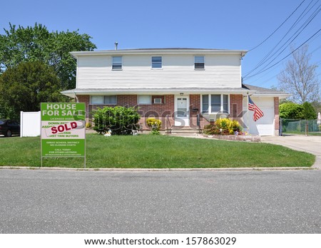 Sold Real Estate For Sale Sign Front Yard Lawn suburban High Ranch Style Home with Electrical Lines Clear Blue sky