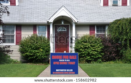 Real Estate For Sale Sign front Yard lawn of Suburban Home USA Residential Neighborhood