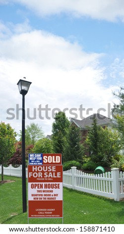 Real Estate Sold For Sale Sign Street Lamppost Light Suburban Residential Neighborhood USA Blue Sky clouds