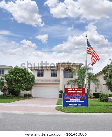 Open House Real Estate For Sale Sign American Flag Landscaped Front yard Lawn Residential Neighborhood Suburban Home USA Blue Sky Clouds