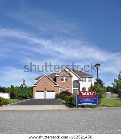 House For Sale Real Estate Sign No Closing Costs Affordable Suburban Brick McMansion Home Two Car Garage Lamppost Landscaped front yard Residential Neighborhood Blue Sky Clouds USA