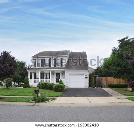 Suburban Home Driveway Way Mailbox Flowers Landscaped Front Yard Residential Neighborhood Blue Sky Clouds USA