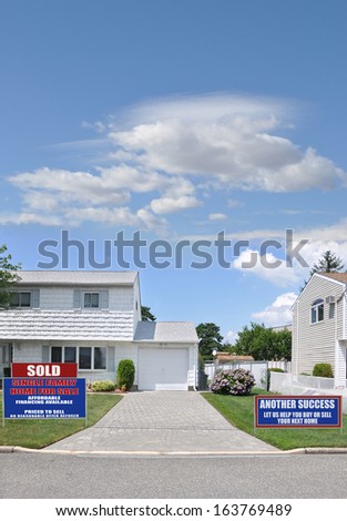 Sold Real Estate Sign Another Success Let Us Help You Buy Sell Your Next Home Suburban High Ranch Home Brick Driveway Residential Neighborhood Street Blue Sky Clouds USA