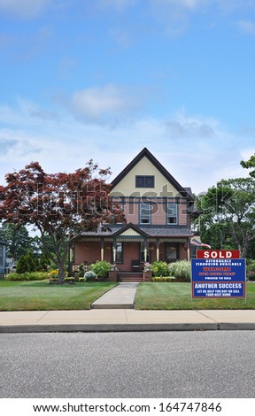 Sold Another Success Let Us Help You Buy Sell Your Next Home Real Estate Sign Suburban Victorian Home Residential Neighborhood USA Blue Sky Clouds