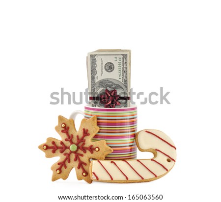 Christmas Shortbread Butter Cookies Snowflake Candy Cake One Hundred Dollar Bills wrapped in Red Ribbon with Bow in Striped Cup isolated on white background