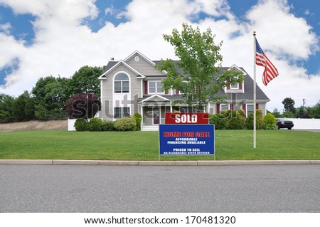 Sold Real Estate sign Suburban McMansion Home Residential Neighborhood USA Blue Sky Clouds