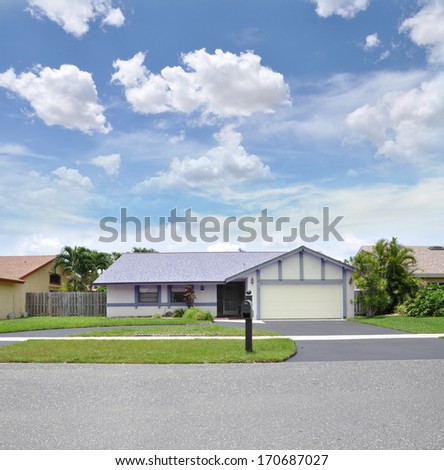 Suburban Ranch Style Home Curbside Mailbox Sidewalk Residential Neighborhood Street USA Blue Sky Clouds
