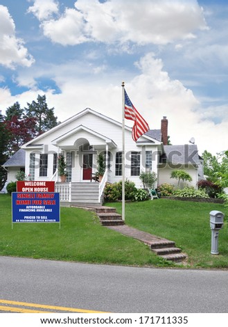 American Flag pole  real estate for sale welcome open house sign suburban home residential neighborhood USA blue sky clouds