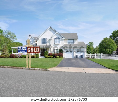 Sold Real Estate Sign Adult Mannequin Suburban Mcmansion house front sunny blue sky clouds USA residential neighborhood