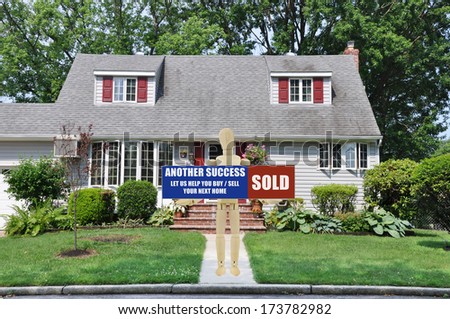 Sold Real Estate Sign held Adult Wood Mannequin Standing front yard walkway of suburban cape cod style home residential neighborhood USA