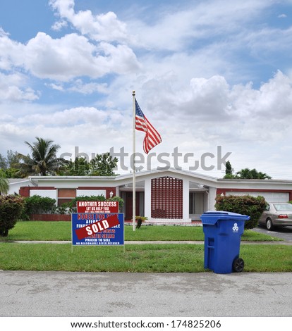 Sold Real Estate Sign American Flag Recycle Trash Container Suburban Ranch Home Residential neighborhood USA