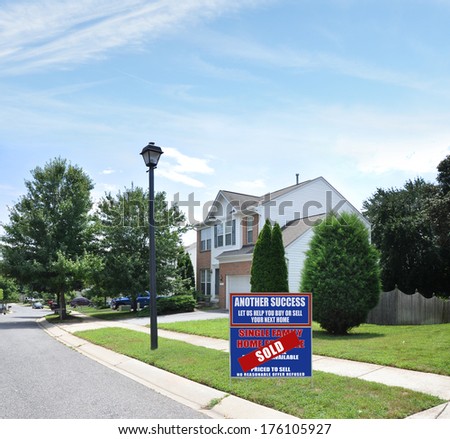 Sold Real Estate (Another success let us help you buy sell your next home) Sign Suburban McMansion Home Residential neighborhood USA Blue Sky Clouds
